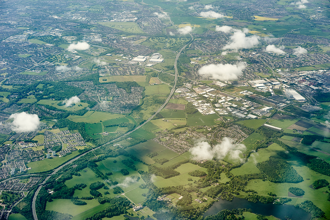 aerial-view-of-green-fields-and-motorway-england-2022-03-07-23-59-51-utc